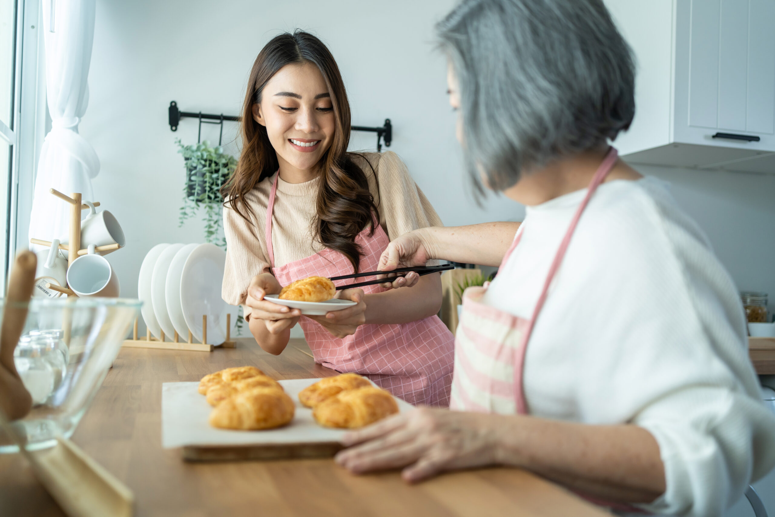 asian-lovely-family-young-daughter-look-to-old-mo-2021-12-09-17-45-48-utc