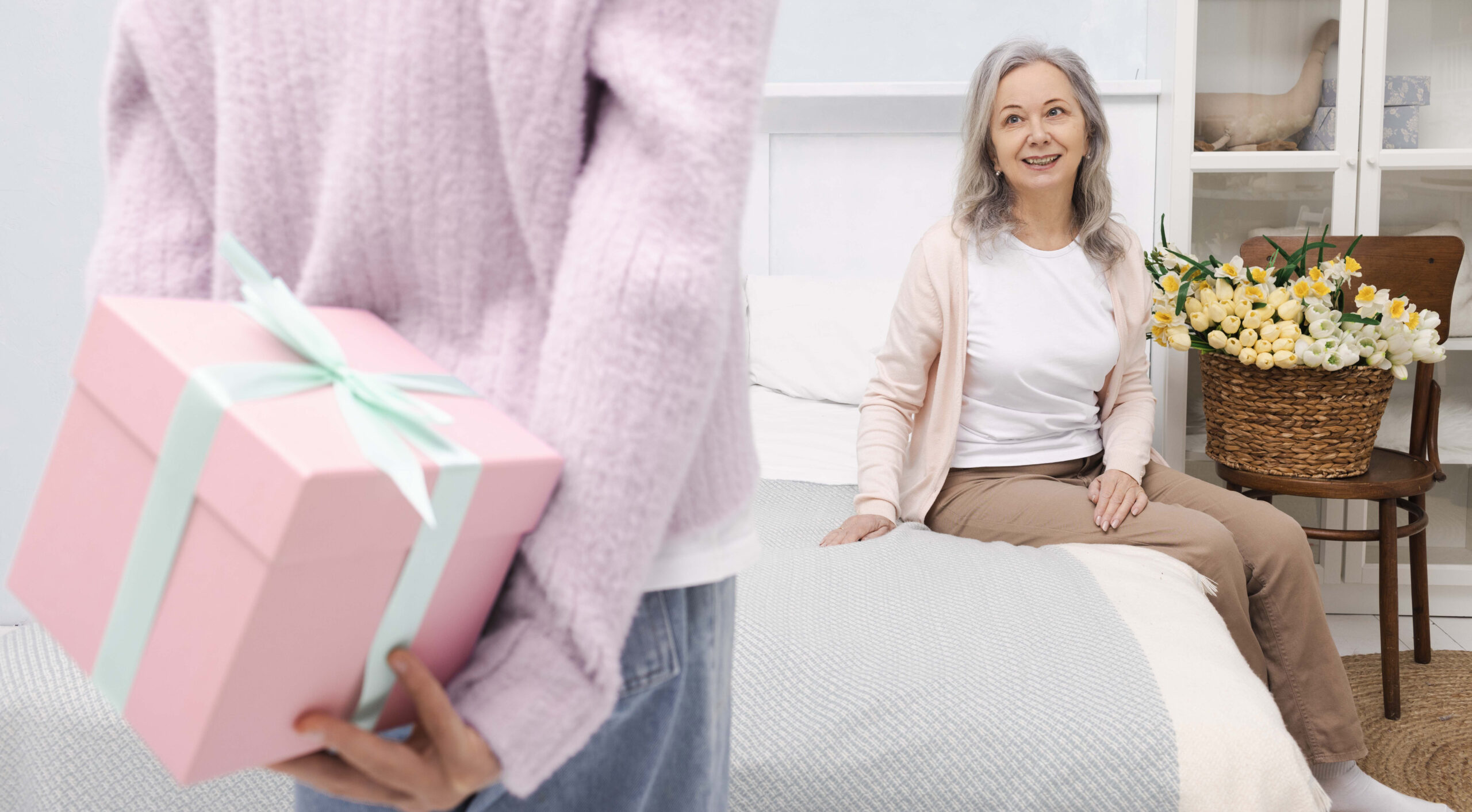 Gift for senior woman on her birthday from her granddaughter in gift box. Family holidays