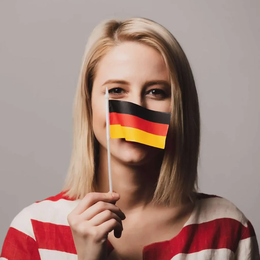 młoda kobieta z flagą Niemiec - kandydatka na opiekunkę